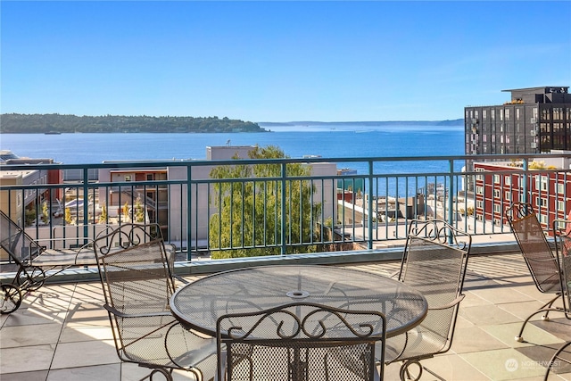 balcony featuring a water view