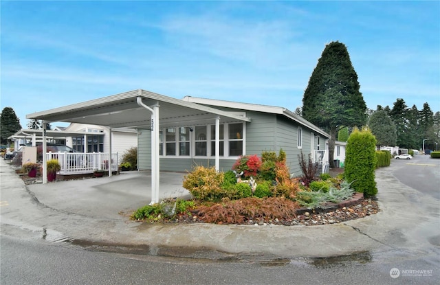 exterior space featuring a carport