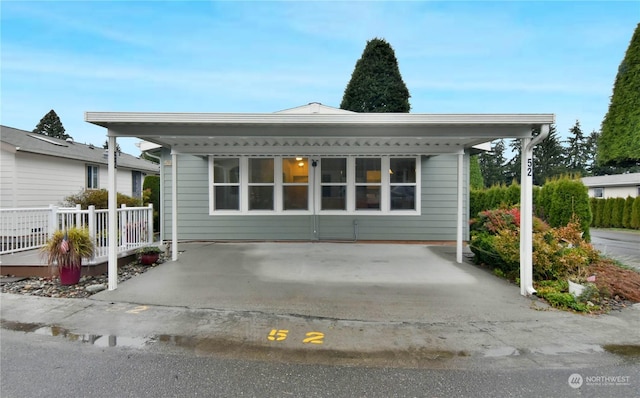 exterior space featuring a carport