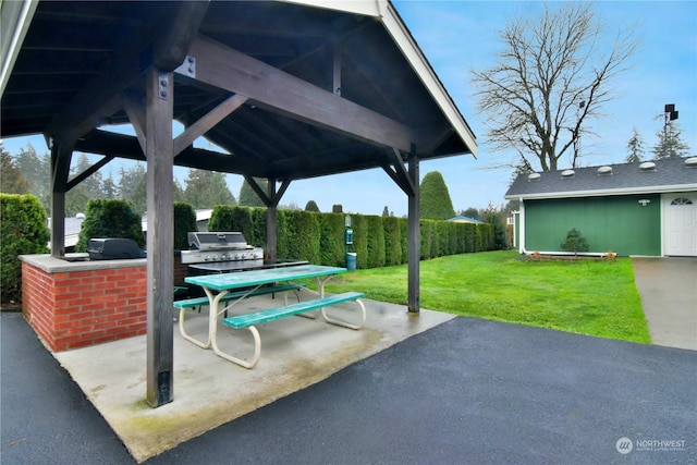 view of patio with a gazebo, a grill, and an outdoor kitchen