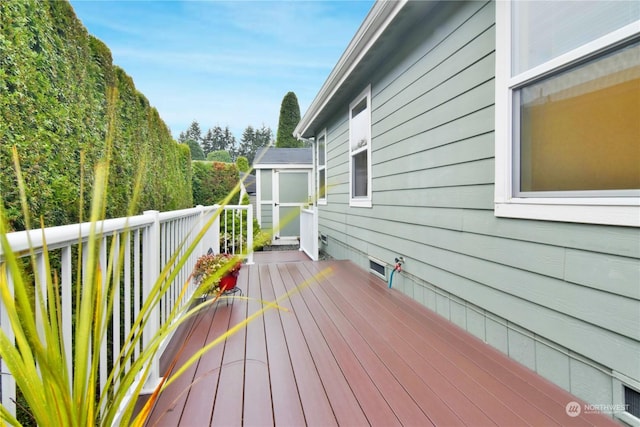 deck featuring a storage shed