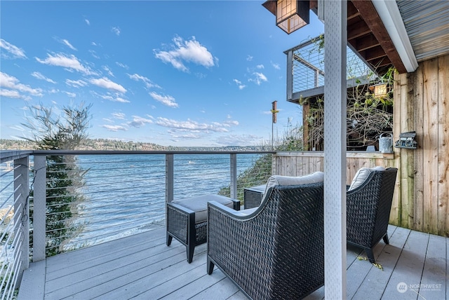 wooden terrace with a water view