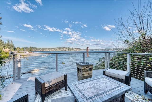 deck featuring a water view