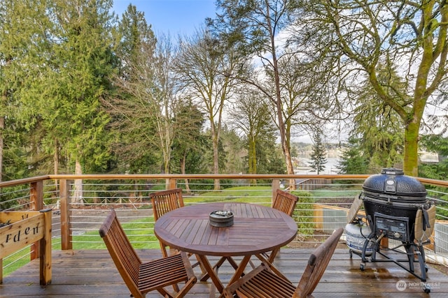 wooden terrace featuring a grill