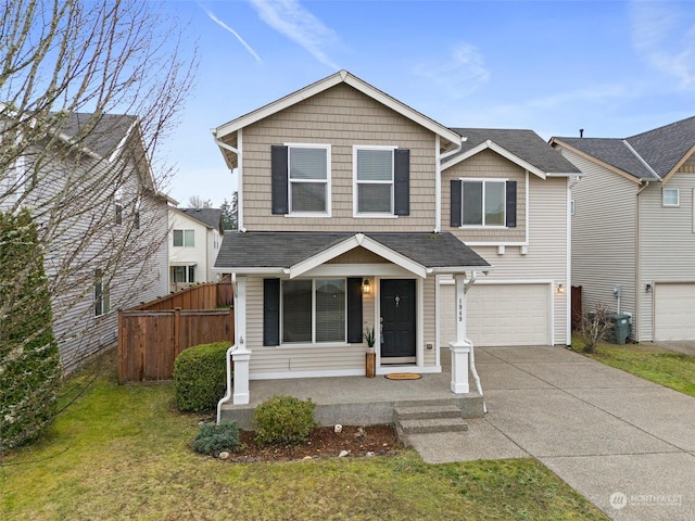 front of property featuring a front yard and a garage