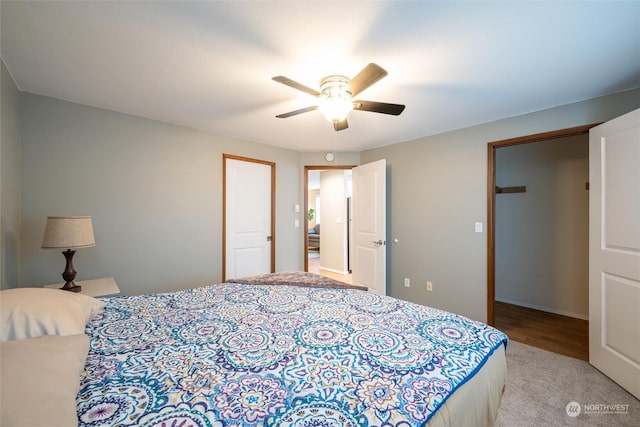 bedroom with light colored carpet and ceiling fan