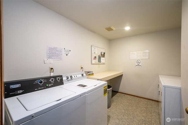 laundry area with independent washer and dryer