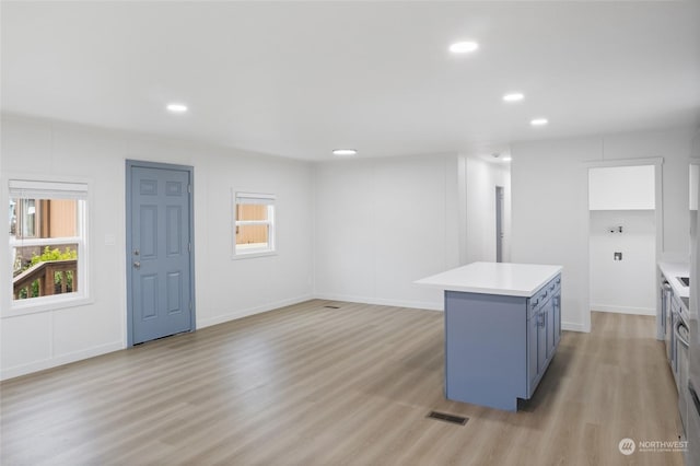 kitchen featuring a center island and light hardwood / wood-style flooring