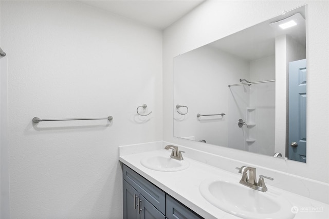 bathroom featuring vanity and a shower