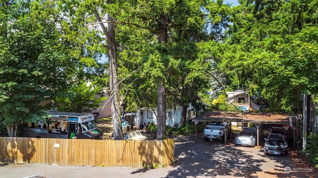 view of property hidden behind natural elements