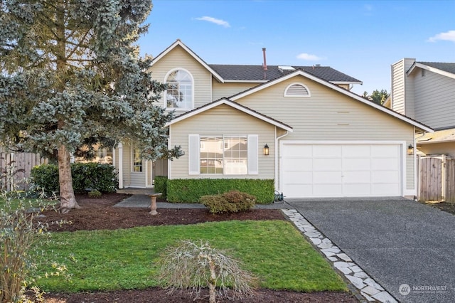 front facade featuring a front yard and a garage