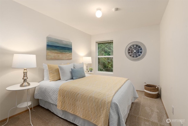 bedroom featuring light carpet