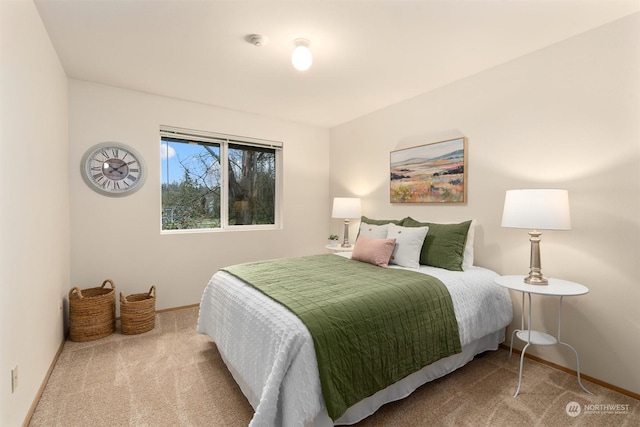 bedroom featuring light colored carpet