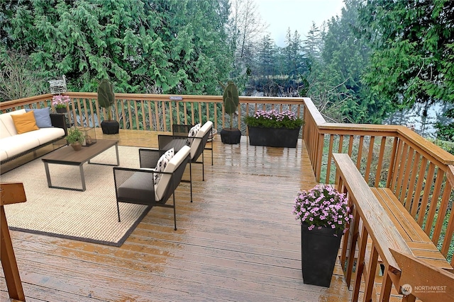 wooden deck featuring an outdoor living space