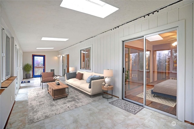 living area featuring a skylight