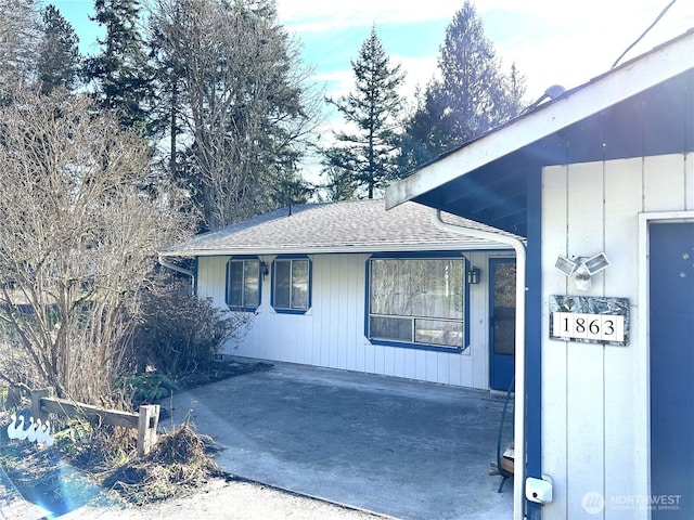 exterior space with a shingled roof