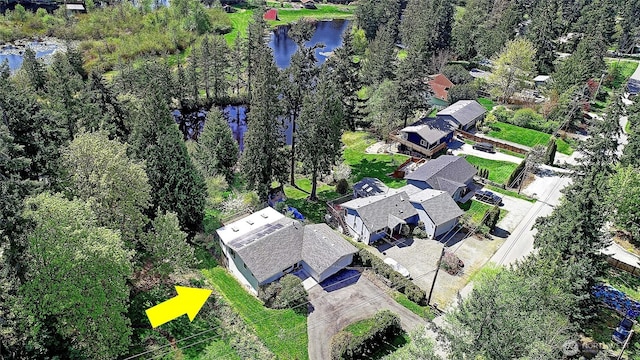 birds eye view of property with a residential view and a water view
