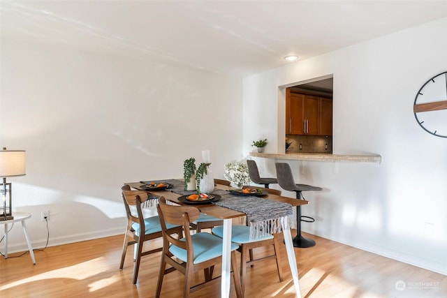 dining room featuring light wood-type flooring