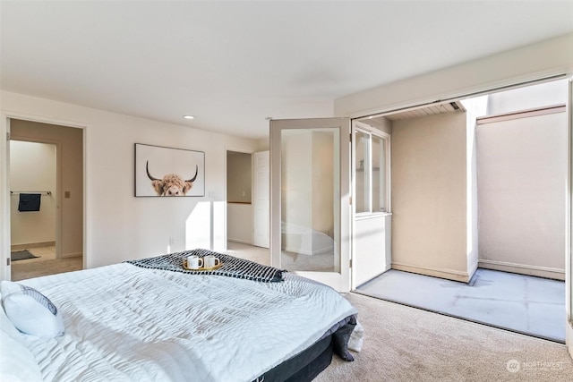 bedroom featuring a closet and light carpet