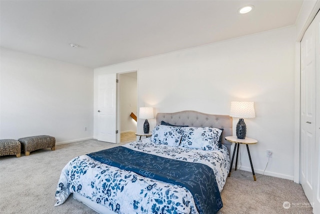 carpeted bedroom featuring a closet