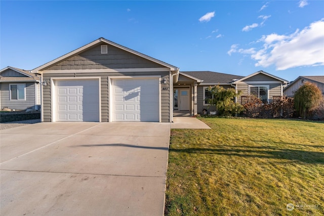 single story home featuring a front lawn and a garage