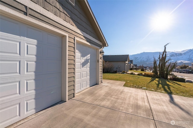 exterior space featuring a mountain view and a yard