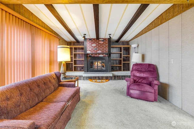 carpeted living room with vaulted ceiling with beams, wood walls, and a brick fireplace