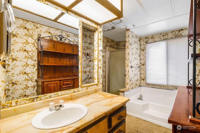 bathroom featuring plus walk in shower and vanity