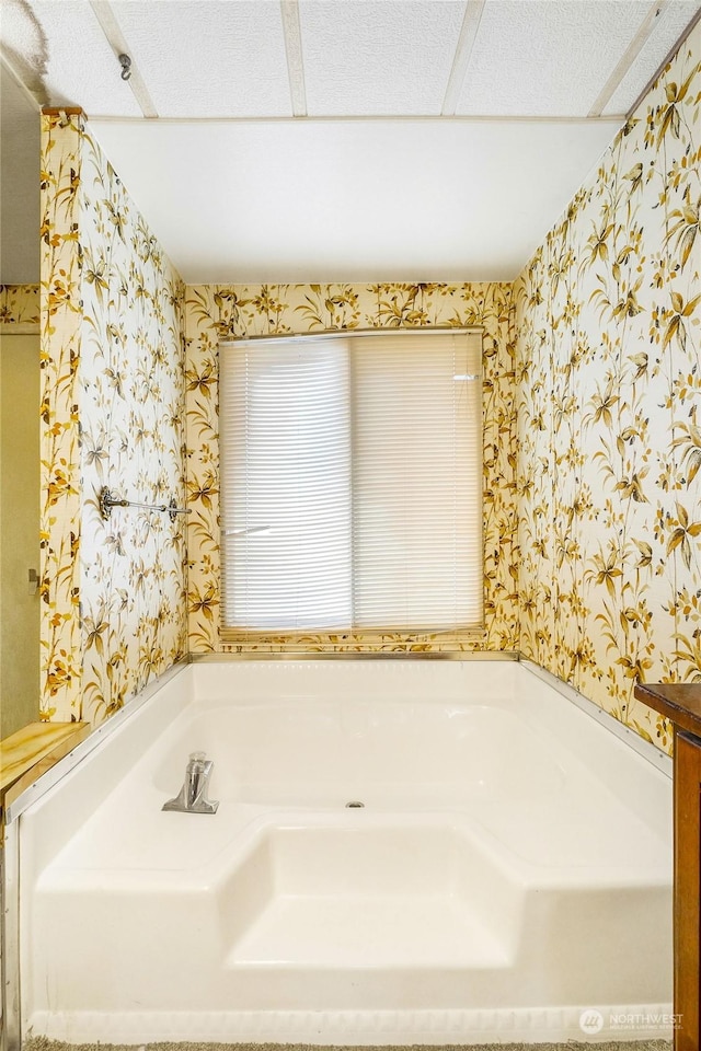 bathroom featuring a tub to relax in