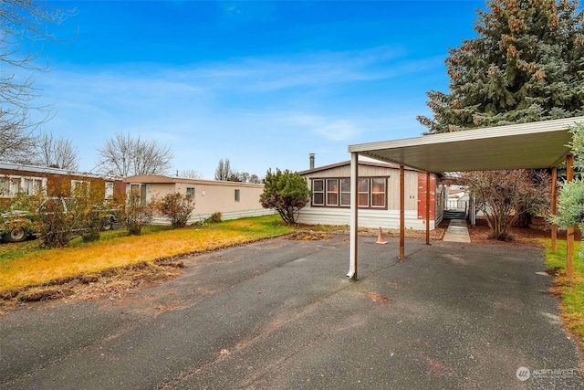 exterior space with a carport