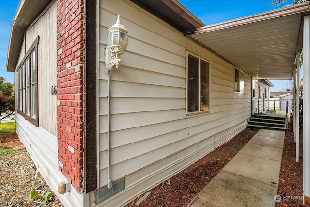 view of side of property with a porch