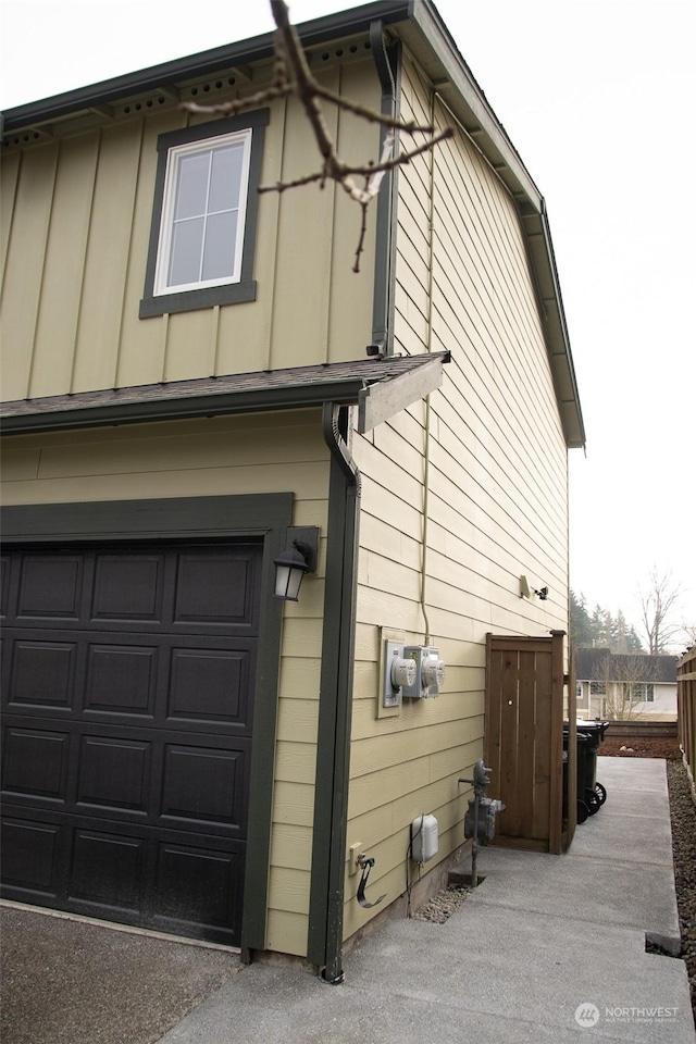 view of side of property featuring a garage