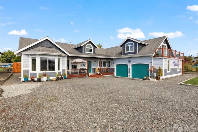 view of front of home with covered porch and a garage