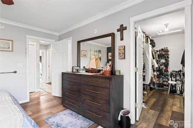 bedroom featuring dark hardwood / wood-style flooring and ornamental molding