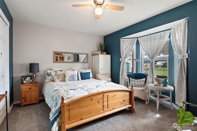 bedroom with dark colored carpet, a closet, and ceiling fan