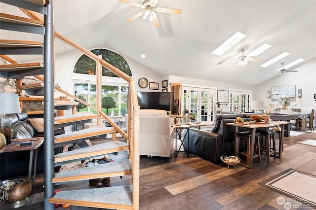 living room featuring lofted ceiling with skylight, french doors, and dark hardwood / wood-style floors