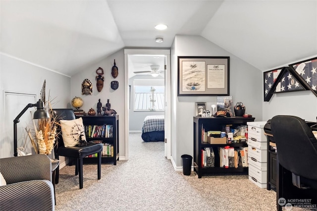 office area featuring light colored carpet, ceiling fan, and lofted ceiling