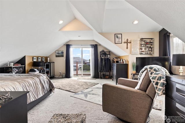 carpeted bedroom with vaulted ceiling