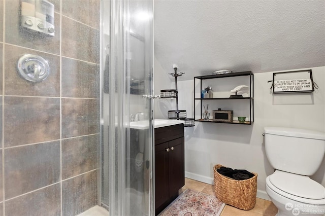 bathroom with tile patterned flooring, toilet, a shower with door, and a textured ceiling