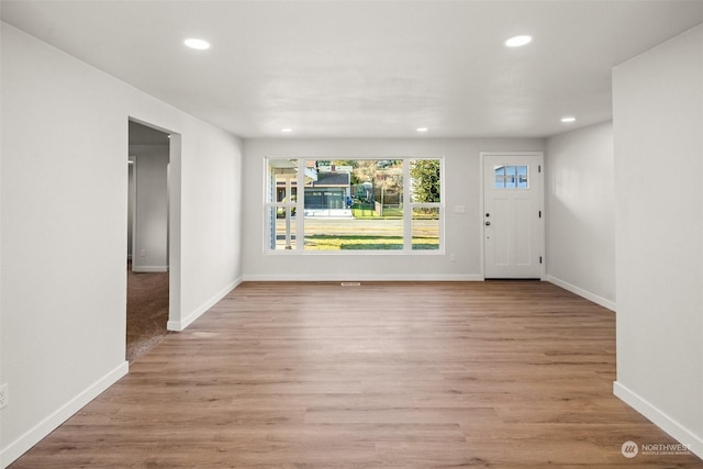 foyer with light hardwood / wood-style floors