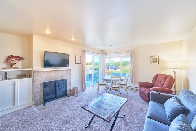 living room with light carpet and a tiled fireplace