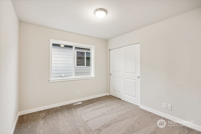 spare room featuring carpet floors