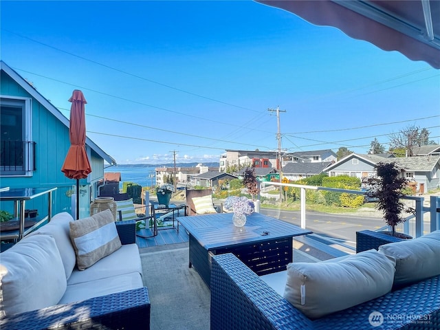 view of patio / terrace featuring a water view and outdoor lounge area