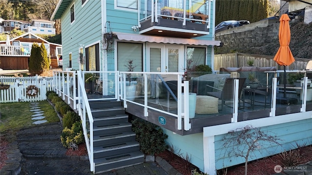 view of side of property featuring a balcony