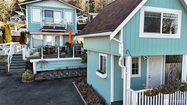 rear view of house with a balcony