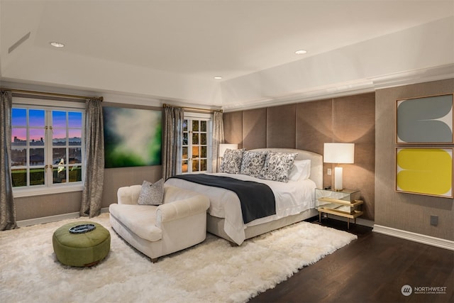 bedroom featuring a raised ceiling and hardwood / wood-style floors