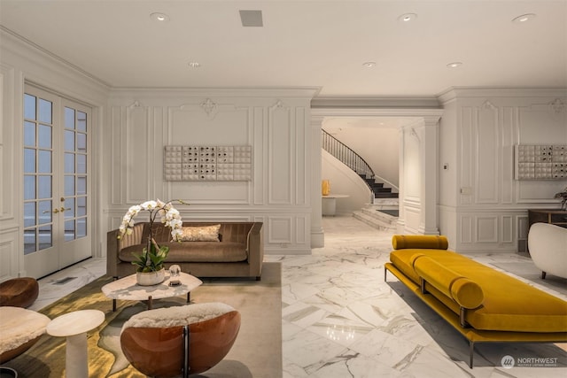 living area featuring french doors and ornamental molding