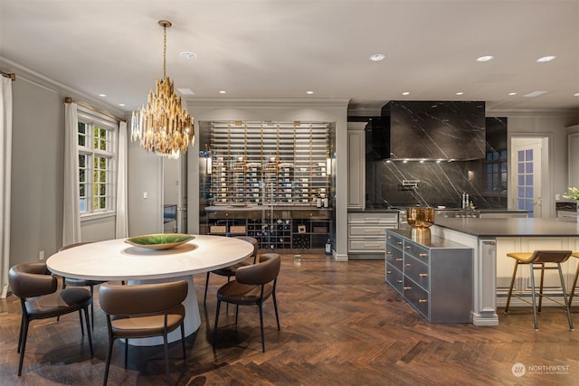 dining space featuring dark parquet flooring and ornamental molding