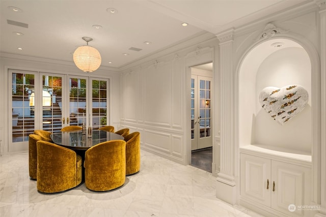 dining area featuring french doors and ornamental molding