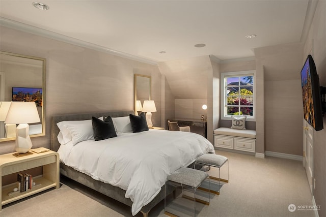 carpeted bedroom with lofted ceiling and ornamental molding